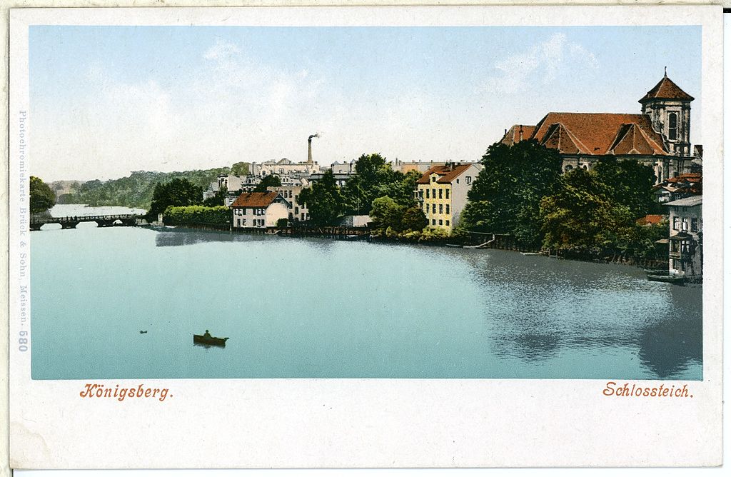 Postcard of buildings by a river. Caption reads ‘Königsberg Schlossteich’
