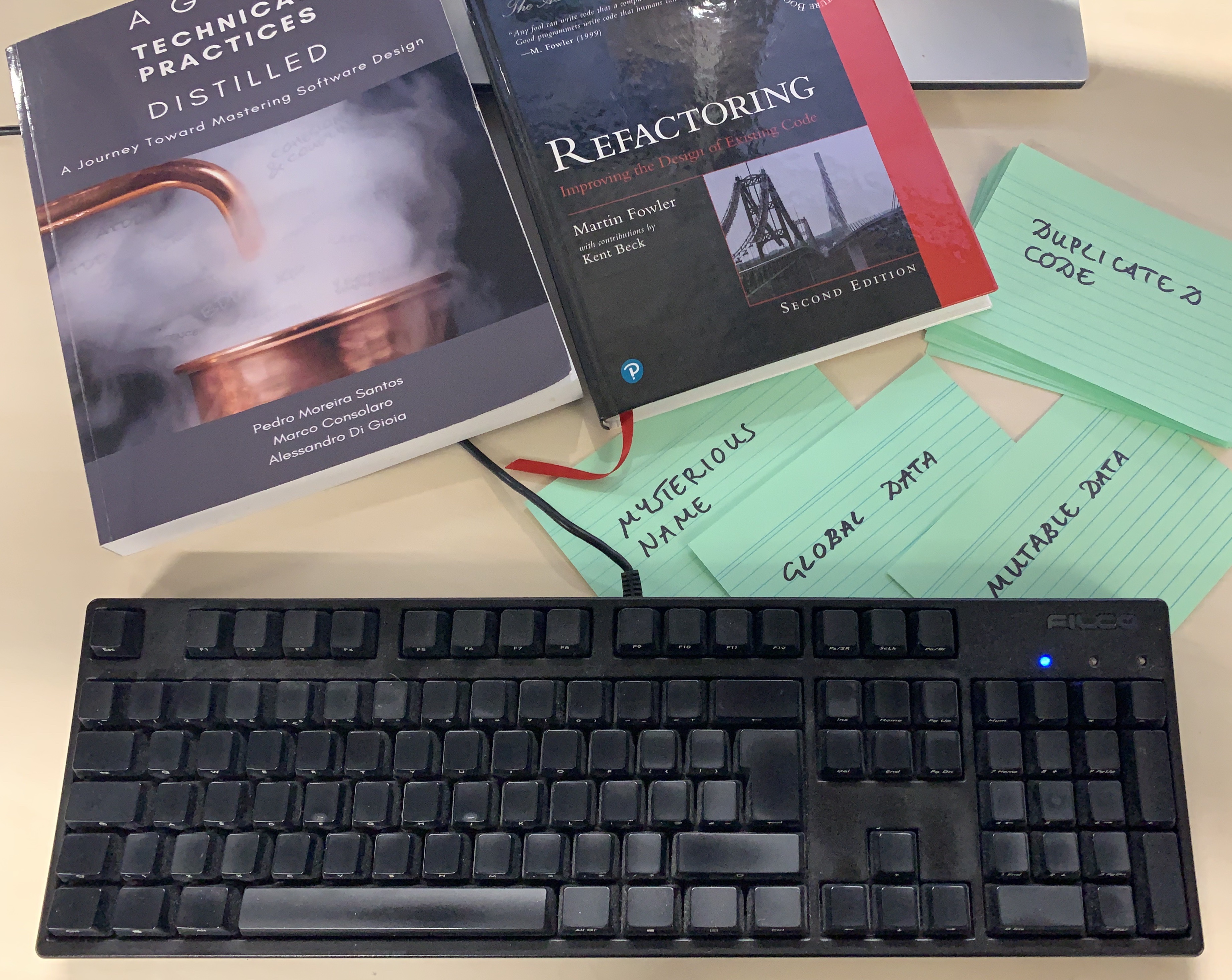 A desktop with resources for the code smells quiz